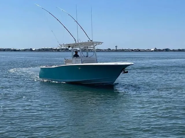 Slide: The Image of 2007 Southport 28 CC boat cruising on calm water with fishing rods. - 42