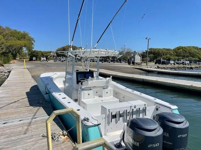 Slide: The Image of 2007 Southport 28 CC boat docked with dual Yamaha 250 engines. - 43