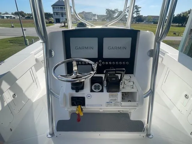 Slide: The Image of 2007 Southport 28 CC boat console with dual Garmin displays and steering wheel. - 5