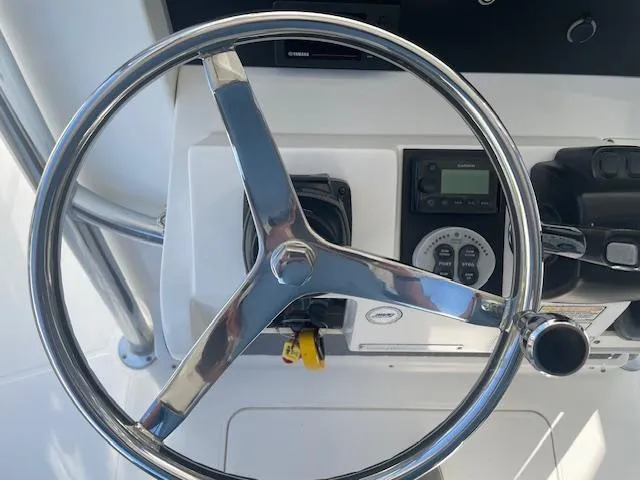 Slide: The Image of Steering wheel of 2007 Southport 28 CC boat with control panel. - 8