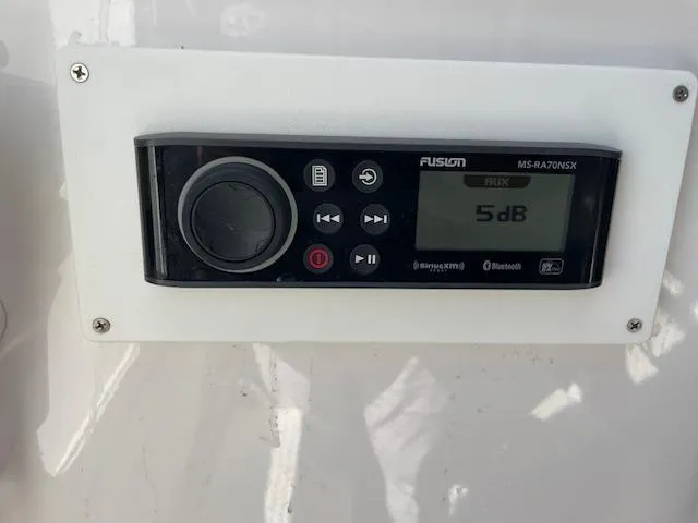 Slide: The Image of Fusion MS-RA70NSX marine stereo on 2007 Southport 28 CC boat dashboard. - 9