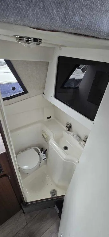 Slide: The Image of 1994 Bayliner 2858 Cierra boat bathroom with compact design and modern fixtures. - 10