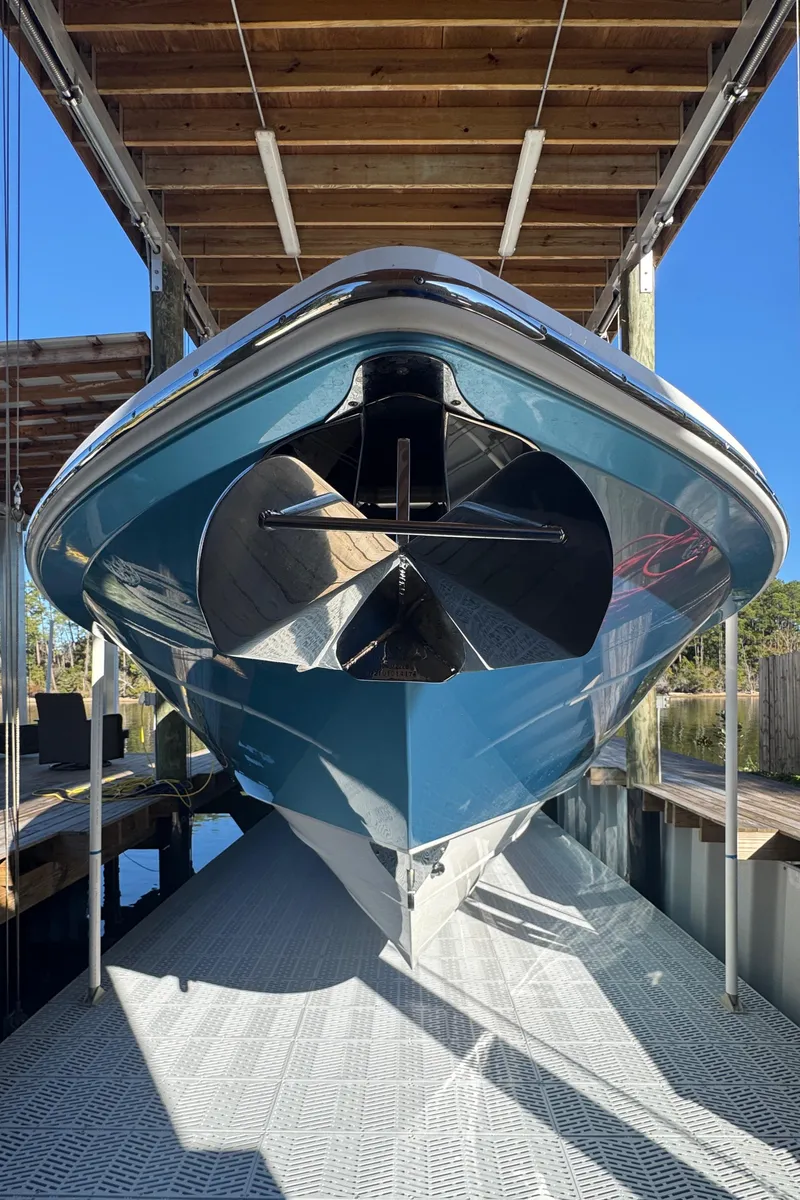 Slide: The Image of 2016 Everglades 435 Center Console boat in dock, viewed from the front. - 13