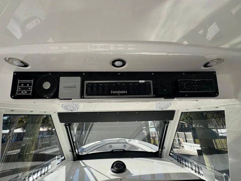 Slide: The Image of 2016 Everglades 435 Center Console dashboard with Garmin electronics and control panel. - 22
