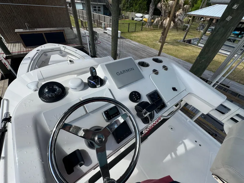 Slide: The Image of 2016 Everglades 435 Center Console boat dashboard with Garmin navigation system. - 24