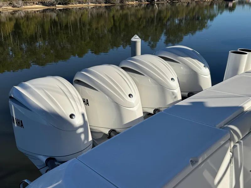Slide: The Image of Four Yamaha outboard engines on a 2016 Everglades 435 Center Console boat. - 41