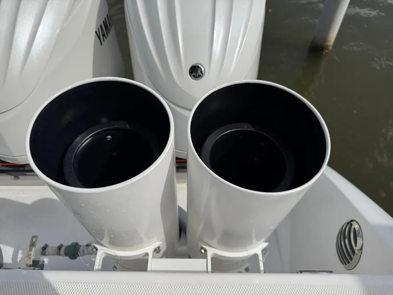 Slide: The Image of Twin exhaust ports on a 2016 Everglades 435 Center Console boat. - 46