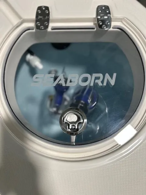 Slide: The Image of 2025 Sea Born LX26 Center Console livewell with clear lid and secure latch. - 17