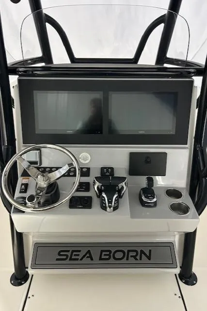 Slide: The Image of 2025 Sea Born LX26 Center Console dashboard with dual screens and steering wheel. - 3