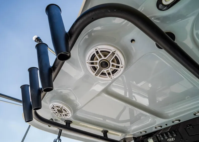 Slide: The Image of 2025 Sea Hunt Gamefish 27 FS boat with rod holders and speakers on the T-top. - 14