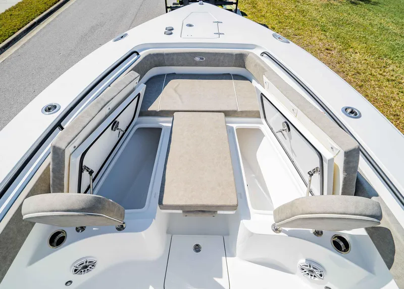 Slide: The Image of 2025 Sea Hunt Gamefish 27 FS boat interior with open storage compartments and cushioned seating. - 25