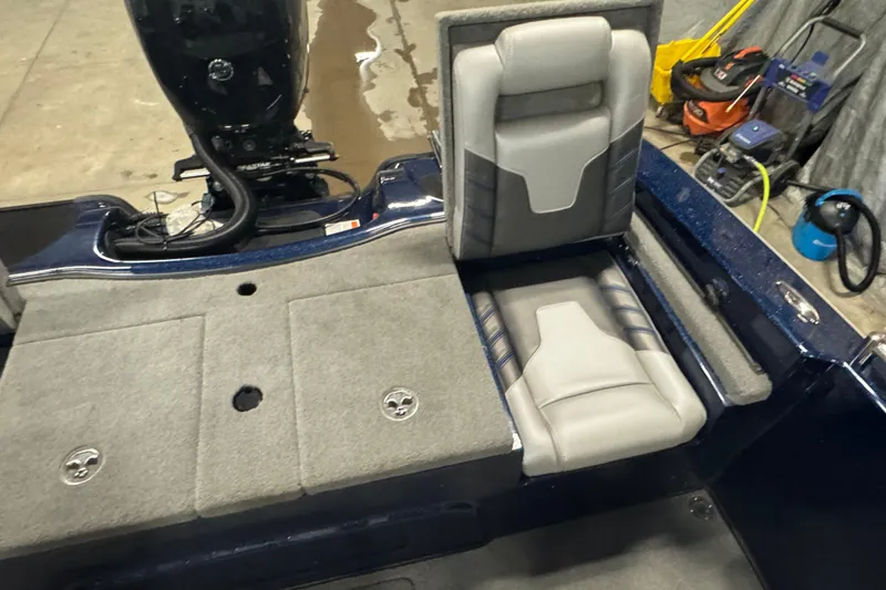 Slide: The Image of 2024 Nitro ZV19 Sport boat interior with gray seating and carpeted deck. - 6