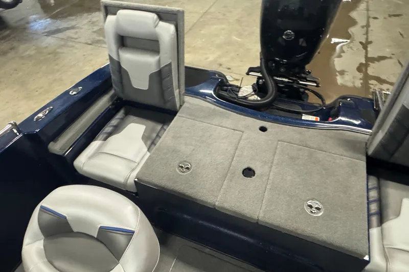 Slide: The Image of 2024 Nitro ZV19 Sport boat interior with gray seating and motor. - 7