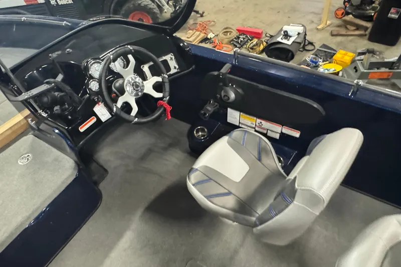 Slide: The Image of 2024 Nitro ZV19 Sport boat interior with steering wheel and seating. - 8