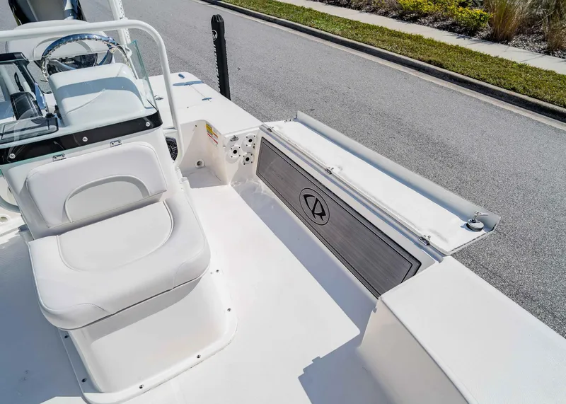 Slide: The Image of 2024 Spyder FX 19 Vapor boat interior with white seating and sleek design. - 10