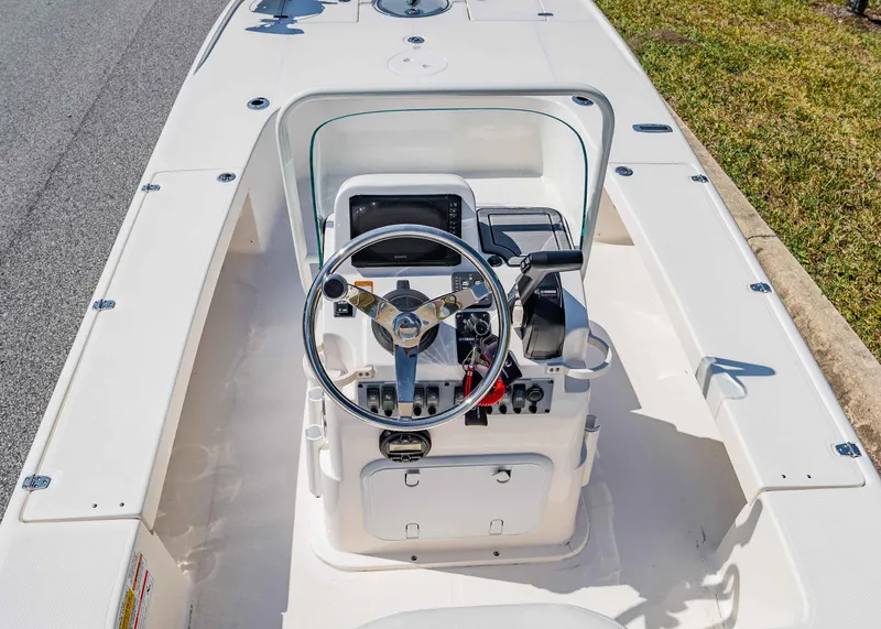 Slide: The Image of 2024 Spyder FX 19 Vapor boat console with steering wheel and controls. - 11