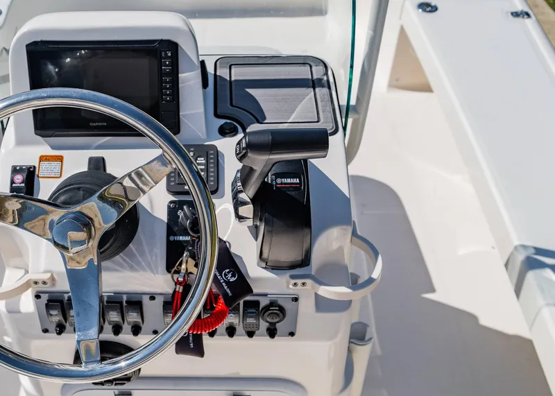 Slide: The Image of 2024 Spyder FX 19 Vapor boat console with steering wheel and controls. - 12