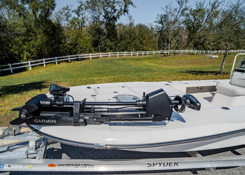Slide: The Image of 2024 Spyder FX 19 Vapor boat with Garmin equipment on trailer, outdoor setting. - 4