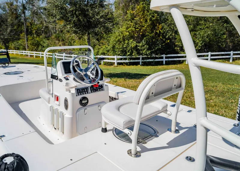 Slide: The Image of 2024 Spyder FX 19 Vapor boat interior with steering console and seating. - 8