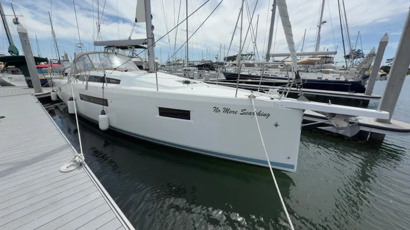 Slide: The Image of 2022 Jeanneau Sun Odyssey 410 sailboat docked at marina, side view. - 18