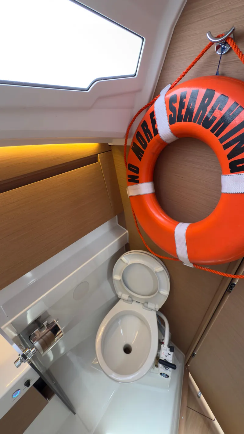 Slide: The Image of 2022 Jeanneau Sun Odyssey 410 bathroom with life preserver and modern fixtures. - 21
