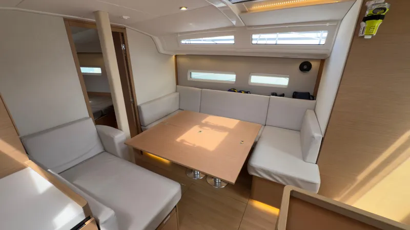 Slide: The Image of Modern interior of 2022 Jeanneau Sun Odyssey 410 yacht with spacious seating and natural light. - 9