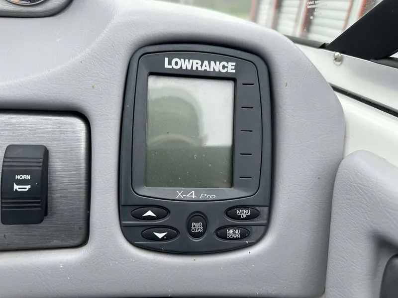 Slide: The Image of Lowrance X-4 Pro fishfinder on 2009 Skeeter SL 190 boat dashboard. - 2