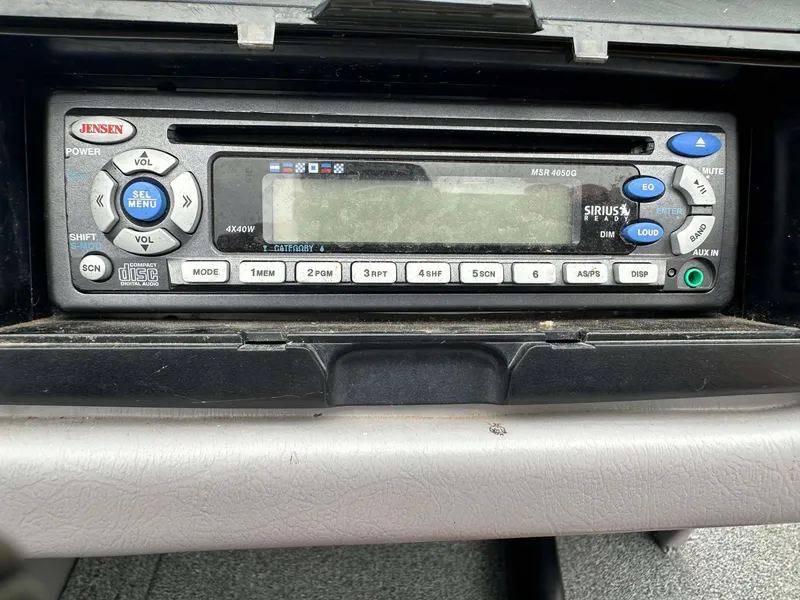 Slide: The Image of Jensen stereo system in a 2009 Skeeter SL 190 boat dashboard. - 21