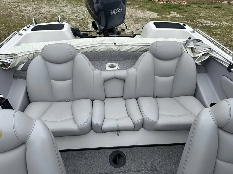 Slide: The Image of 2009 Skeeter SL 190 boat interior with gray seating and Yamaha 150 outboard motor. - 22