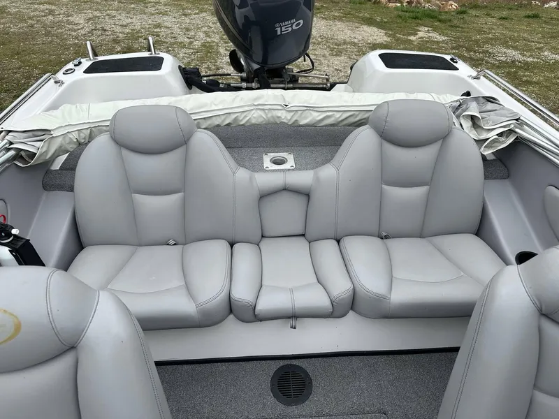 Slide: The Image of 2009 Skeeter SL 190 boat interior with gray seating and Yamaha 150 engine. - 30