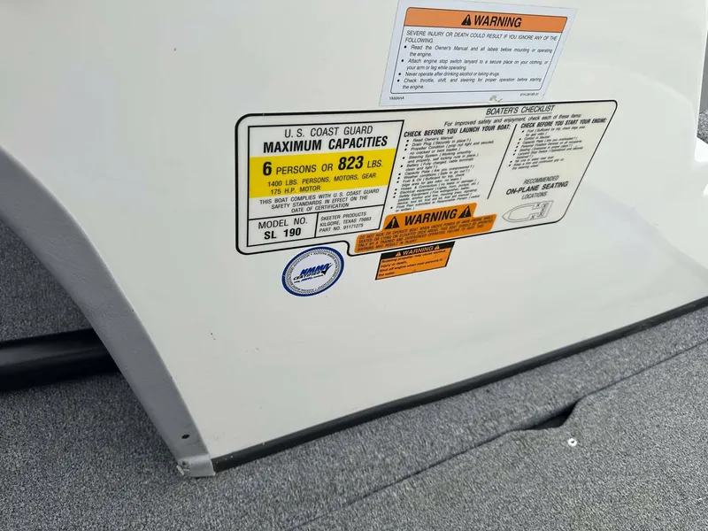 Slide: The Image of 2009 Skeeter SL 190 capacity label, maximum 6 persons or 823 lbs, safety warnings visible. - 31