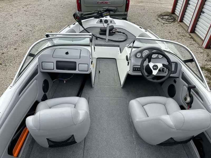 Slide: The Image of 2009 Skeeter SL 190 boat interior with gray seats and steering wheel. - 5