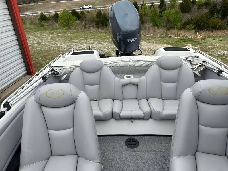 Slide: The Image of 2009 Skeeter SL 190 boat interior with gray seating and Yamaha 150 outboard motor. - 7