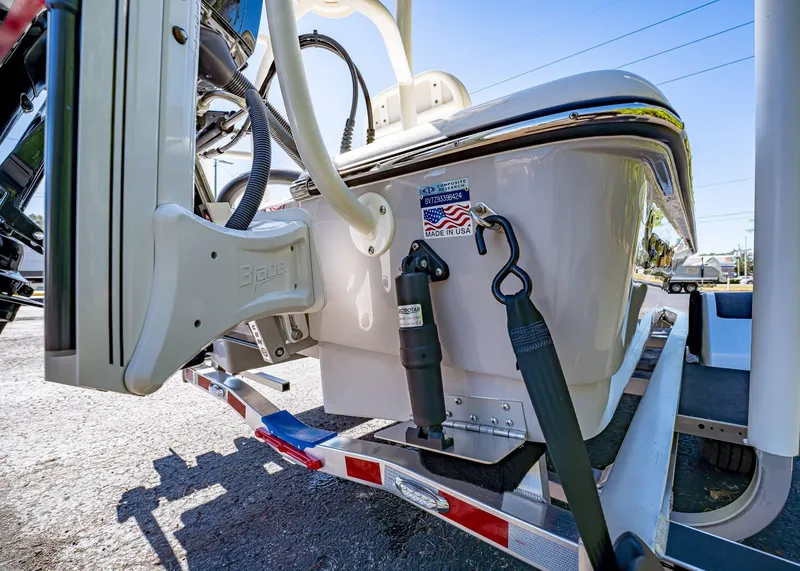 Slide: The Image of 2024 Spyder FX 19 Vapor boat on trailer, showcasing rear details and components. - 16