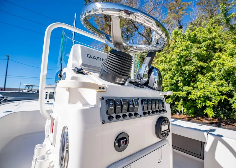 Slide: The Image of 2024 Spyder FX 19 Vapor boat console with steering wheel and control panel. - 21