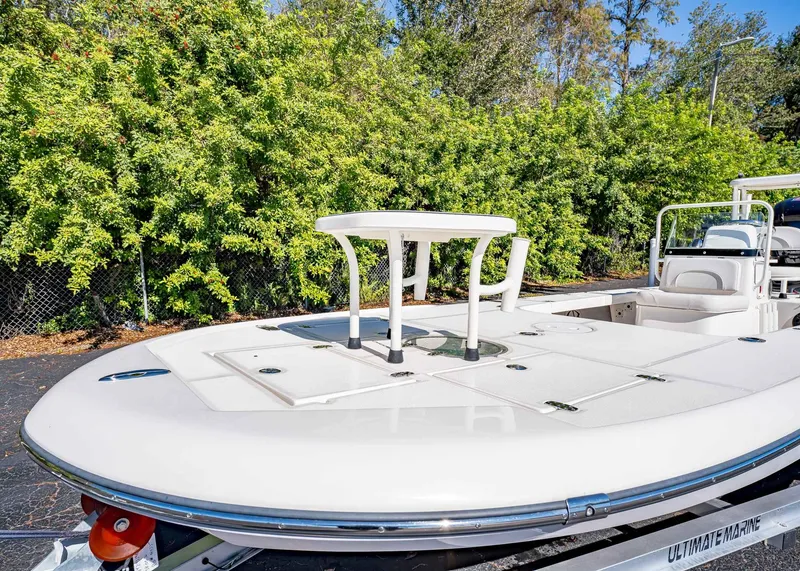 Slide: The Image of 2024 Spyder FX 19 Vapor boat on trailer, surrounded by lush greenery. - 3