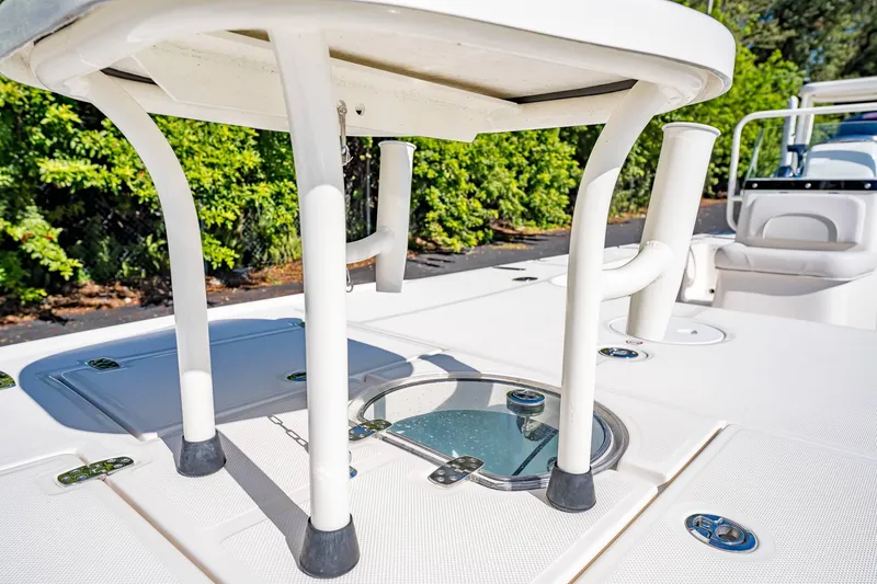 Slide: The Image of 2024 Spyder FX 19 Vapor boat deck with rod holders and storage compartments. - 4