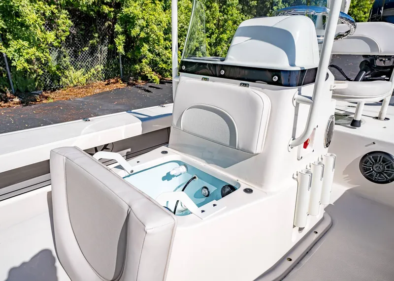 Slide: The Image of 2024 Spyder FX 19 Vapor boat interior with open storage compartment and seating. - 7