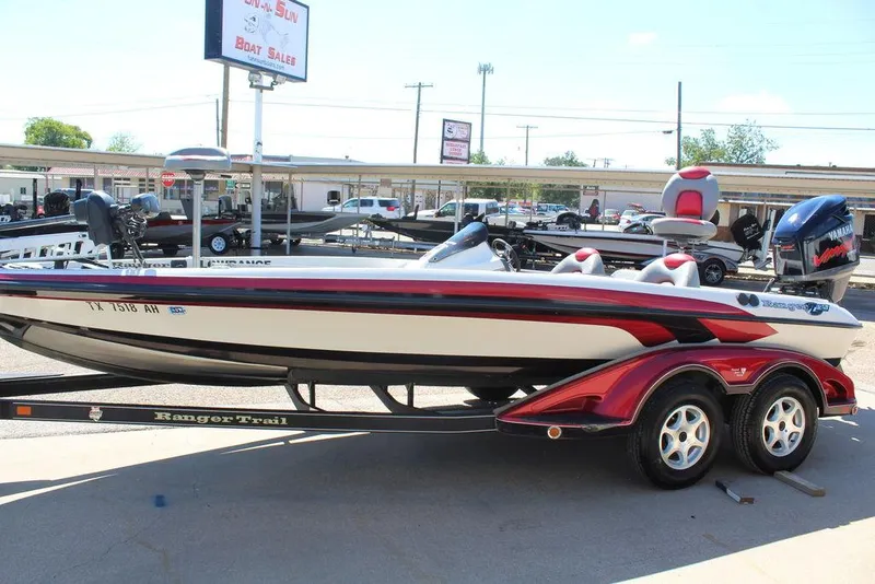 Slide: The Image of 2007 Ranger Z21 boat on trailer at dealership, featuring sleek design and vibrant red accents. - 10