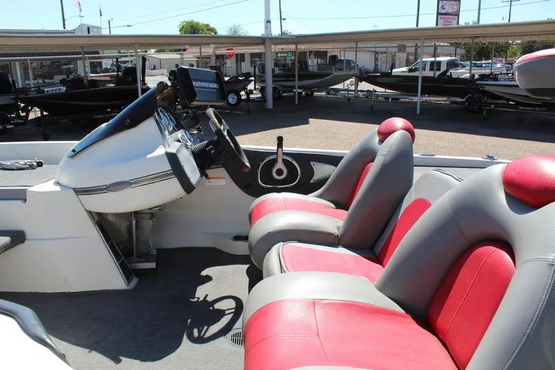 Slide: The Image of 2007 Ranger Z21 boat interior with red and gray seats, steering console visible. - 15