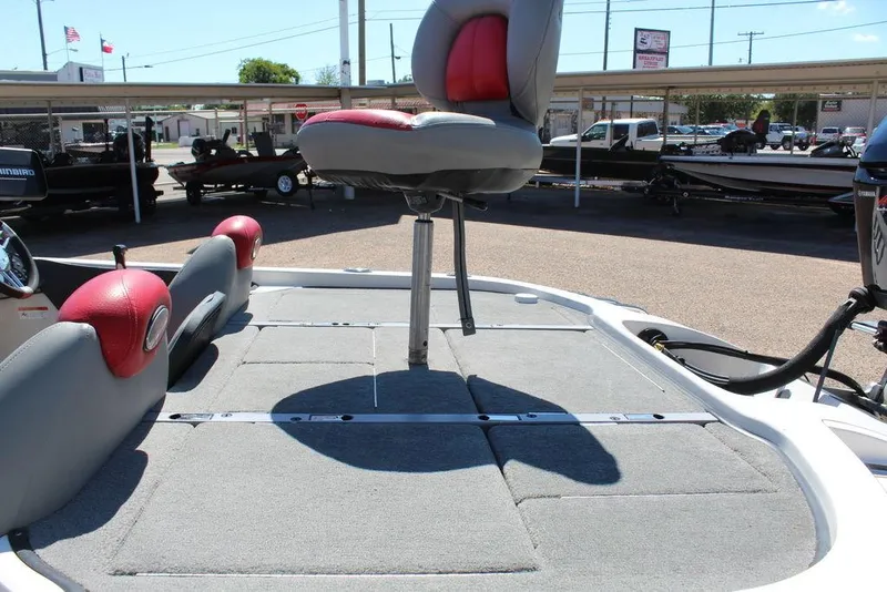 Slide: The Image of 2007 Ranger Z21 boat deck with elevated seat, gray carpet, and red accents. - 16
