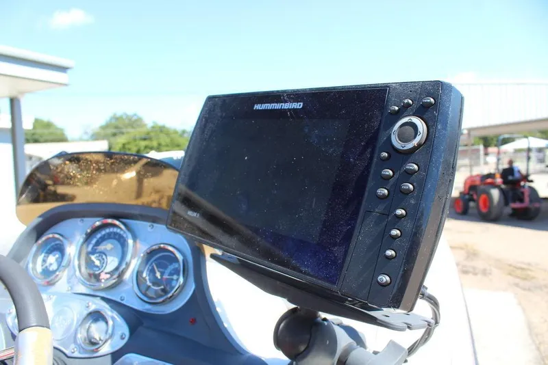 Slide: The Image of Humminbird fish finder on 2007 Ranger Z21 boat dashboard with gauges. - 19