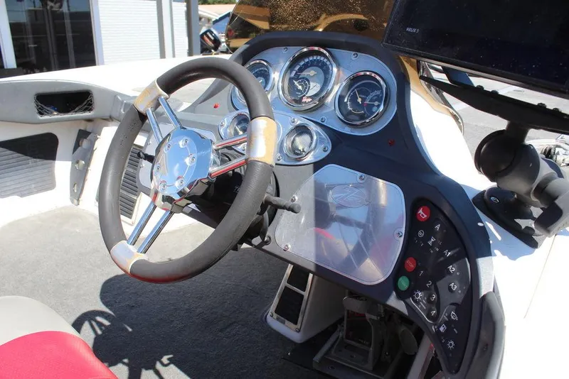 Slide: The Image of Steering console of a 2007 Ranger Z21 boat with gauges and controls. - 20