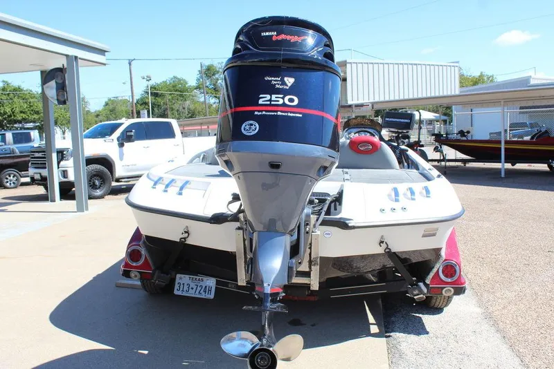 Slide: The Image of 2007 Ranger Z21 boat with Yamaha 250 outboard motor, parked outdoors. - 6