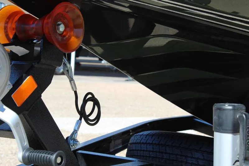 Slide: The Image of Trailer hitch and winch of 2025 Phoenix 920 Elite II boat. - 10