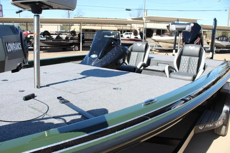 Slide: The Image of 2025 Phoenix 920 Elite II boat with sleek design and modern seating. - 14