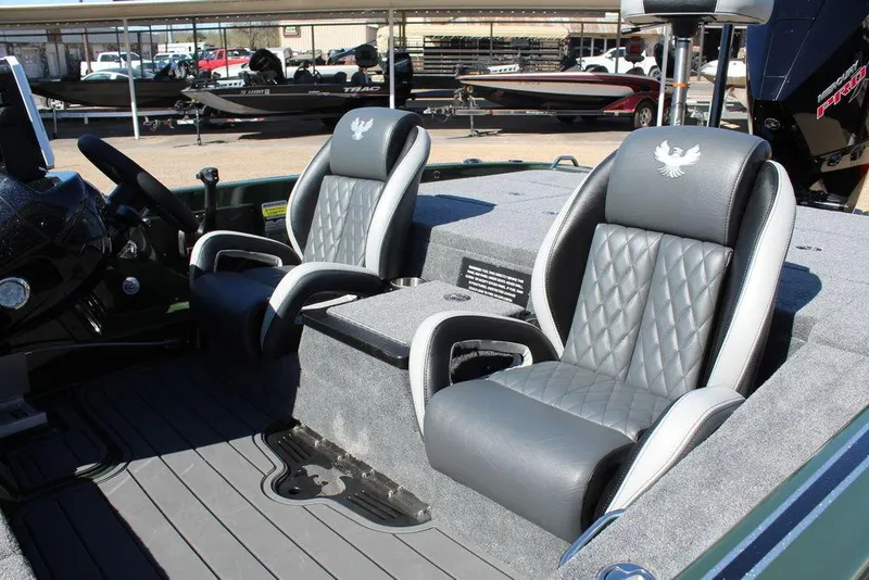 Slide: The Image of 2025 Phoenix 920 Elite II boat interior with luxurious gray seating and modern design. - 15
