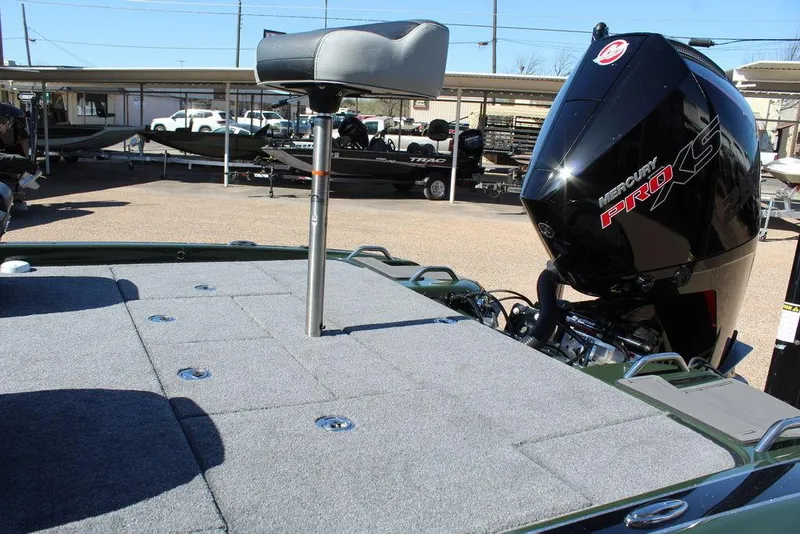 Slide: The Image of 2025 Phoenix 920 Elite II boat with Mercury Pro XS engine, featuring a spacious deck and seat. - 16