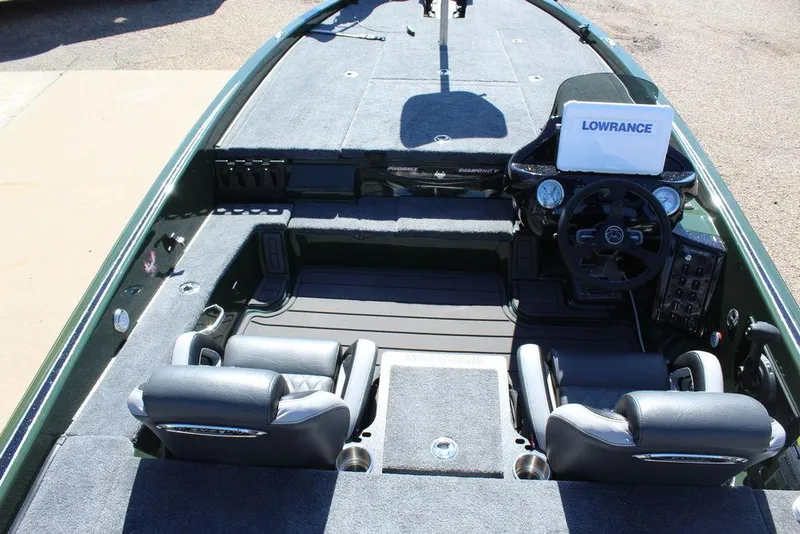 Slide: The Image of 2025 Phoenix 920 Elite II boat interior with dual seats and Lowrance navigation system. - 19