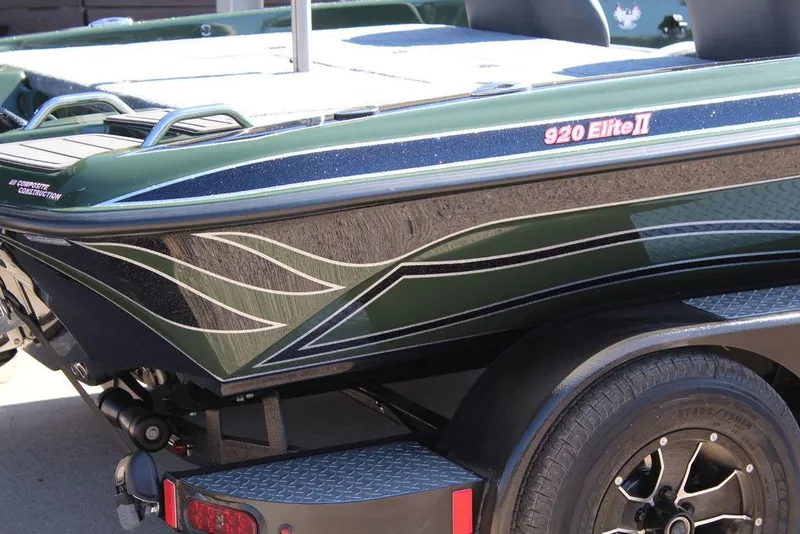 Slide: The Image of 2025 Phoenix 920 Elite II boat with sleek design and custom graphics. - 2